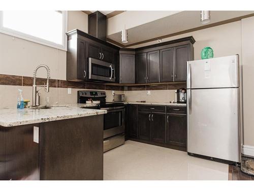 145 Stonecreek Landing, Fort Mcmurray, AB - Indoor Photo Showing Kitchen With Upgraded Kitchen