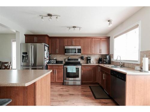 211 Merganser Crescent, Fort Mcmurray, AB - Indoor Photo Showing Kitchen With Stainless Steel Kitchen With Double Sink