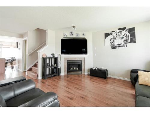 211 Merganser Crescent, Fort Mcmurray, AB - Indoor Photo Showing Living Room With Fireplace