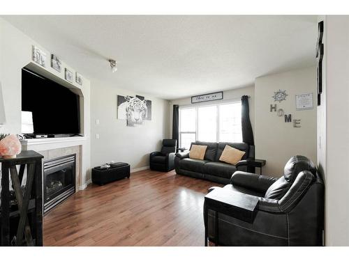 211 Merganser Crescent, Fort Mcmurray, AB - Indoor Photo Showing Living Room With Fireplace