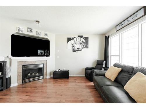 211 Merganser Crescent, Fort Mcmurray, AB - Indoor Photo Showing Living Room With Fireplace