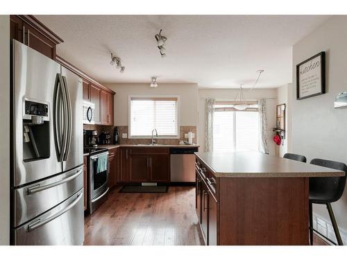 211 Merganser Crescent, Fort Mcmurray, AB - Indoor Photo Showing Kitchen With Stainless Steel Kitchen With Double Sink