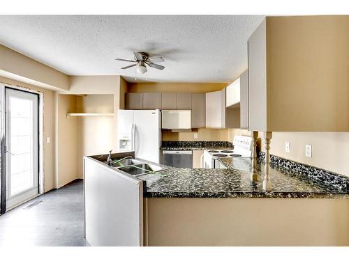 128 Beale Crescent, Fort Mcmurray, AB - Indoor Photo Showing Kitchen With Double Sink