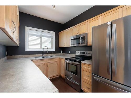 224 Sparrow Hawk Drive, Fort Mcmurray, AB - Indoor Photo Showing Kitchen With Double Sink