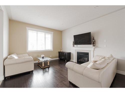 125 Chalifour Street, Fort Mcmurray, AB - Indoor Photo Showing Living Room With Fireplace