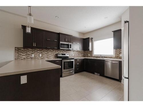 125 Chalifour Street, Fort Mcmurray, AB - Indoor Photo Showing Kitchen With Stainless Steel Kitchen With Upgraded Kitchen