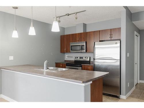 404-136B Sandpiper Road, Fort Mcmurray, AB - Indoor Photo Showing Kitchen With Double Sink