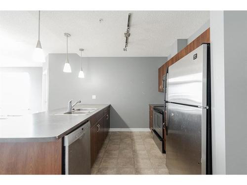 404-136B Sandpiper Road, Fort Mcmurray, AB - Indoor Photo Showing Kitchen With Double Sink