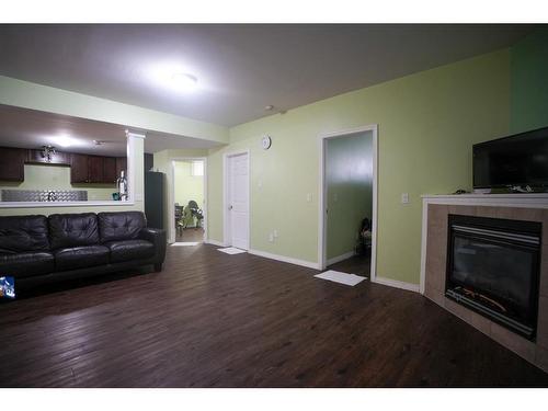 533 Walnut Crescent, Fort Mcmurray, AB - Indoor Photo Showing Living Room With Fireplace
