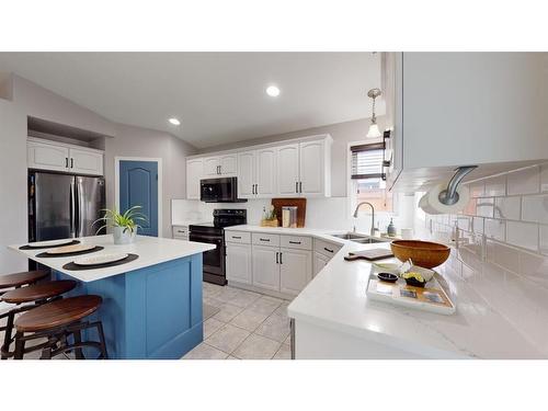 205 Elm Street, Fort Mcmurray, AB - Indoor Photo Showing Kitchen With Double Sink