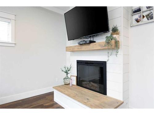 101 Siltstone Place, Fort Mcmurray, AB - Indoor Photo Showing Living Room With Fireplace