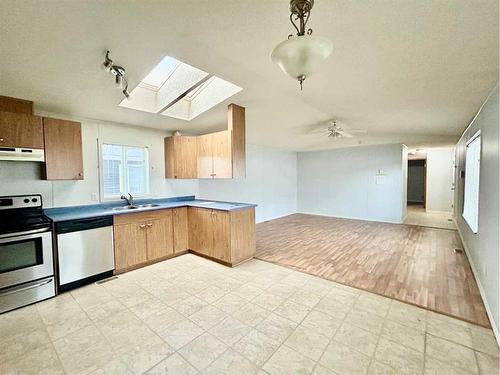 188 Mustang Road Se, Fort Mcmurray, AB - Indoor Photo Showing Kitchen With Double Sink