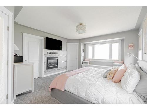 205 Fisher Crescent, Fort Mcmurray, AB - Indoor Photo Showing Bedroom With Fireplace