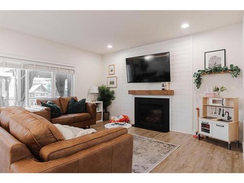 176 Mountain Avens Crescent, Fort Mcmurray, AB - Indoor Photo Showing Living Room With Fireplace