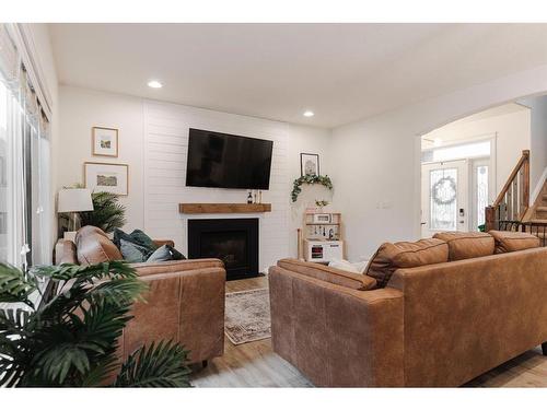 176 Mountain Avens Crescent, Fort Mcmurray, AB - Indoor Photo Showing Living Room With Fireplace