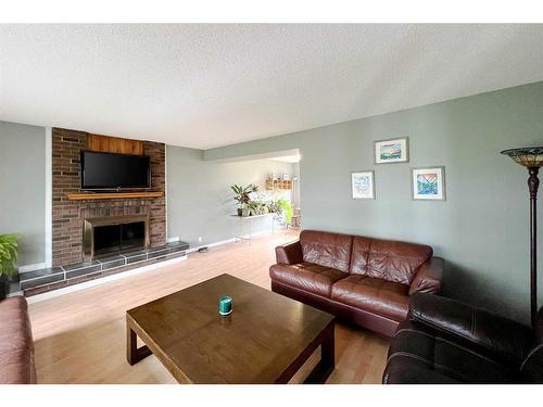 160 Wapiti Crescent, Fort Mcmurray, AB - Indoor Photo Showing Living Room With Fireplace