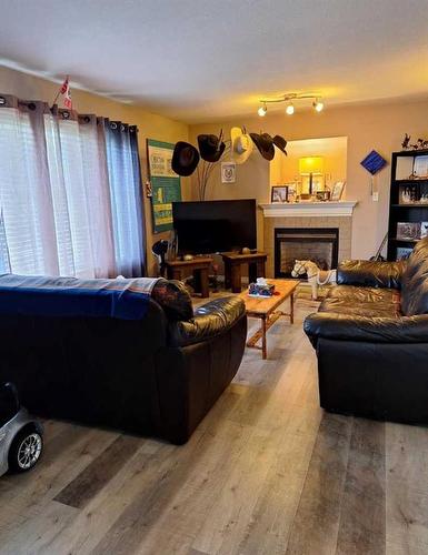 #158 15249 Twp Rd 665A Missawawi Estates Phase Ii, Lac La Biche, AB - Indoor Photo Showing Living Room With Fireplace