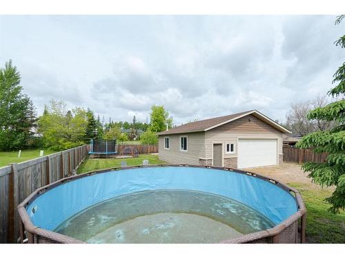 721 Timberline Drive, Fort Mcmurray, AB - Outdoor With Above Ground Pool With Backyard
