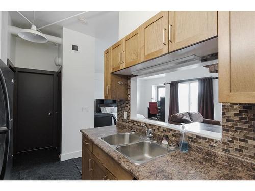 303-8026 Franklin Avenue, Fort Mcmurray, AB - Indoor Photo Showing Kitchen With Double Sink