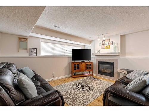 145 Brachett Crescent, Fort Mcmurray, AB - Indoor Photo Showing Living Room With Fireplace