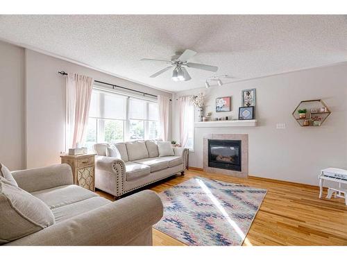 145 Brachett Crescent, Fort Mcmurray, AB - Indoor Photo Showing Living Room With Fireplace