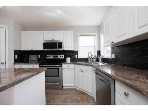 133 Campbell Crescent, Fort Mcmurray, AB - Indoor Photo Showing Kitchen With Double Sink