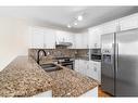 112 Brebeuf Crescent, Fort Mcmurray, AB  - Indoor Photo Showing Kitchen With Double Sink With Upgraded Kitchen 