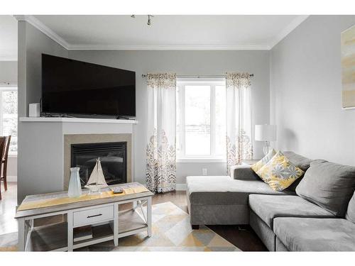 423 Killdeer Way, Fort Mcmurray, AB - Indoor Photo Showing Living Room With Fireplace