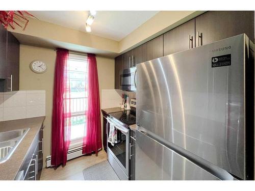 126-201 Abasand Drive, Fort Mcmurray, AB - Indoor Photo Showing Kitchen With Stainless Steel Kitchen With Double Sink