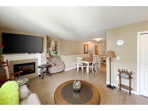 126-201 Abasand Drive, Fort Mcmurray, AB - Indoor Photo Showing Living Room With Fireplace