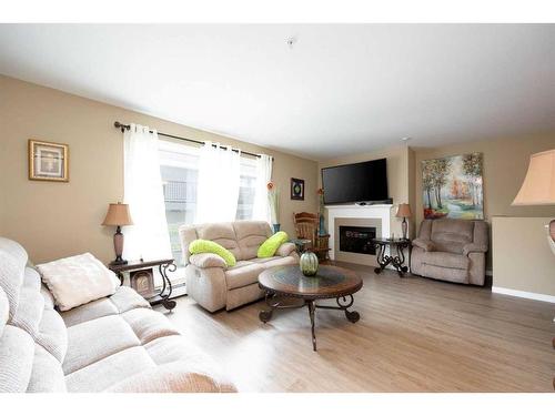 126-201 Abasand Drive, Fort Mcmurray, AB - Indoor Photo Showing Living Room With Fireplace