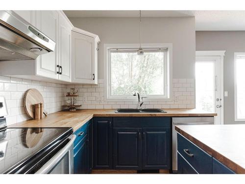 360 Diefenbaker Drive, Fort Mcmurray, AB - Indoor Photo Showing Kitchen With Double Sink