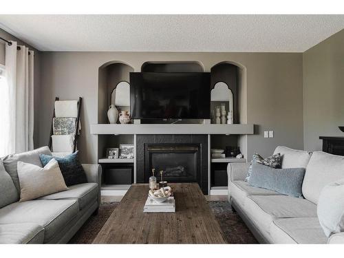 360 Diefenbaker Drive, Fort Mcmurray, AB - Indoor Photo Showing Living Room With Fireplace