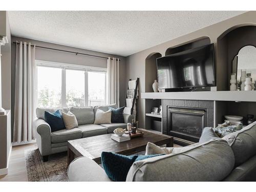 360 Diefenbaker Drive, Fort Mcmurray, AB - Indoor Photo Showing Living Room With Fireplace