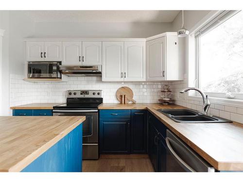 360 Diefenbaker Drive, Fort Mcmurray, AB - Indoor Photo Showing Kitchen With Double Sink