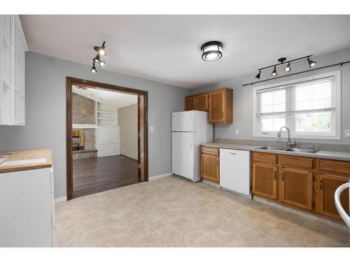 102 Silver Springs Drive, Fort Mcmurray, AB - Indoor Photo Showing Kitchen With Double Sink