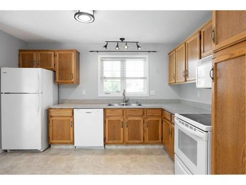 102 Silver Springs Drive, Fort Mcmurray, AB - Indoor Photo Showing Kitchen With Double Sink