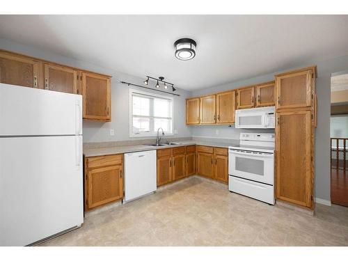 102 Silver Springs Drive, Fort Mcmurray, AB - Indoor Photo Showing Kitchen With Double Sink