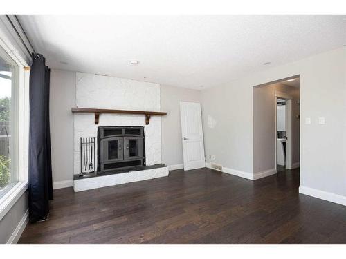 185 Berens Place, Fort Mcmurray, AB - Indoor Photo Showing Living Room With Fireplace