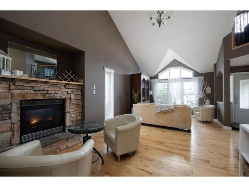 128 Wilson Bay, Fort Mcmurray, AB - Indoor Photo Showing Living Room With Fireplace