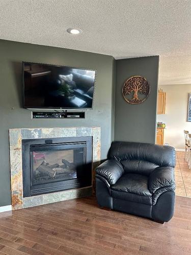 9221 91 Avenue, Lac La Biche, AB - Indoor Photo Showing Living Room With Fireplace