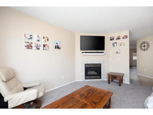 237 Kodiak Crescent, Fort Mcmurray, AB - Indoor Photo Showing Living Room With Fireplace