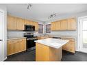 176 Archibald Close, Fort Mcmurray, AB  - Indoor Photo Showing Kitchen With Double Sink 