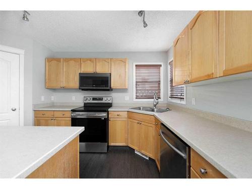 176 Archibald Close, Fort Mcmurray, AB - Indoor Photo Showing Kitchen With Double Sink