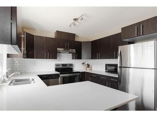 95-401 Athabasca Avenue, Fort Mcmurray, AB - Indoor Photo Showing Kitchen With Stainless Steel Kitchen With Double Sink With Upgraded Kitchen