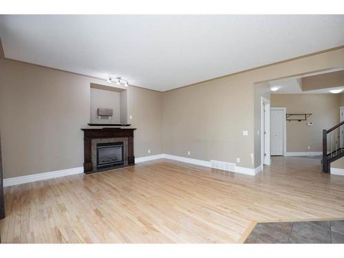 108 Wild Rose Street, Fort Mcmurray, AB - Indoor Photo Showing Living Room With Fireplace