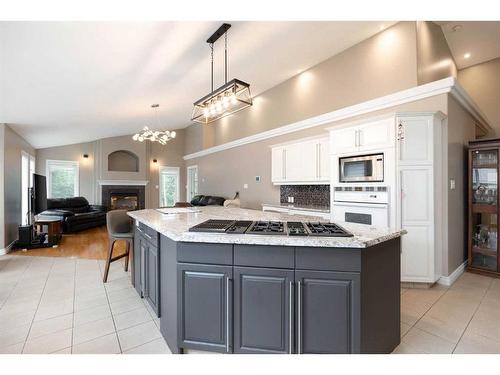 149 Tundra Drive, Fort Mcmurray, AB - Indoor Photo Showing Kitchen With Fireplace