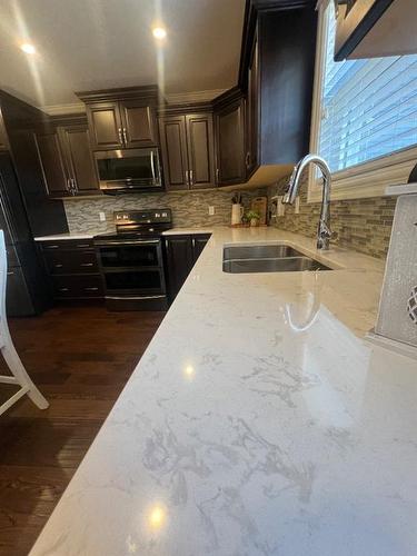 149 Richardson Lane, Fort Mcmurray, AB - Indoor Photo Showing Kitchen With Double Sink
