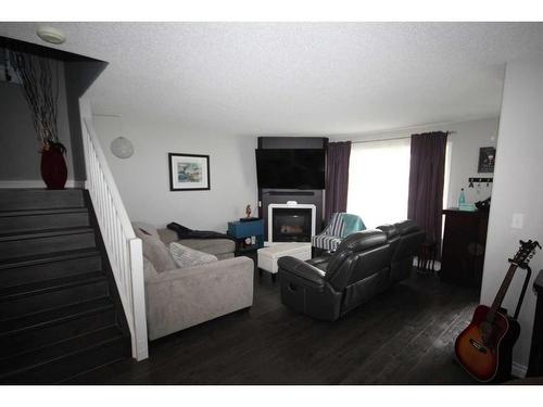 236 Sitka Drive, Fort Mcmurray, AB - Indoor Photo Showing Living Room With Fireplace