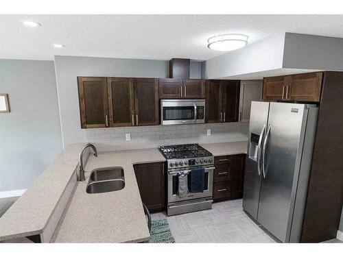 12-284 Shalestone Way, Fort Mcmurray, AB - Indoor Photo Showing Kitchen With Stainless Steel Kitchen With Double Sink